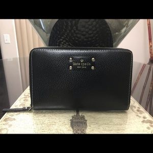 Kate Spade leather travel zip wallet.